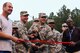 Col. Marty Hughes, 94th Mission Support Group commander, prepares to cut a ribbon during a reopening ceremony at the base track at Dobbins Air Reserve Base, Ga. Nov. 5, 2017. The renovation process lasted about a month as crews worked quickly to have it repaved and restriped. (U.S. Air Force photo/Staff Sgt. Andrew Park)