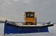 A snow plow clears the runway at Wright-Patterson AFB. Severe weather events like a snow storm can wreak havoc on runways and streets on the installation, causing reporting delays or base closures. (U.S. Air Force photo)