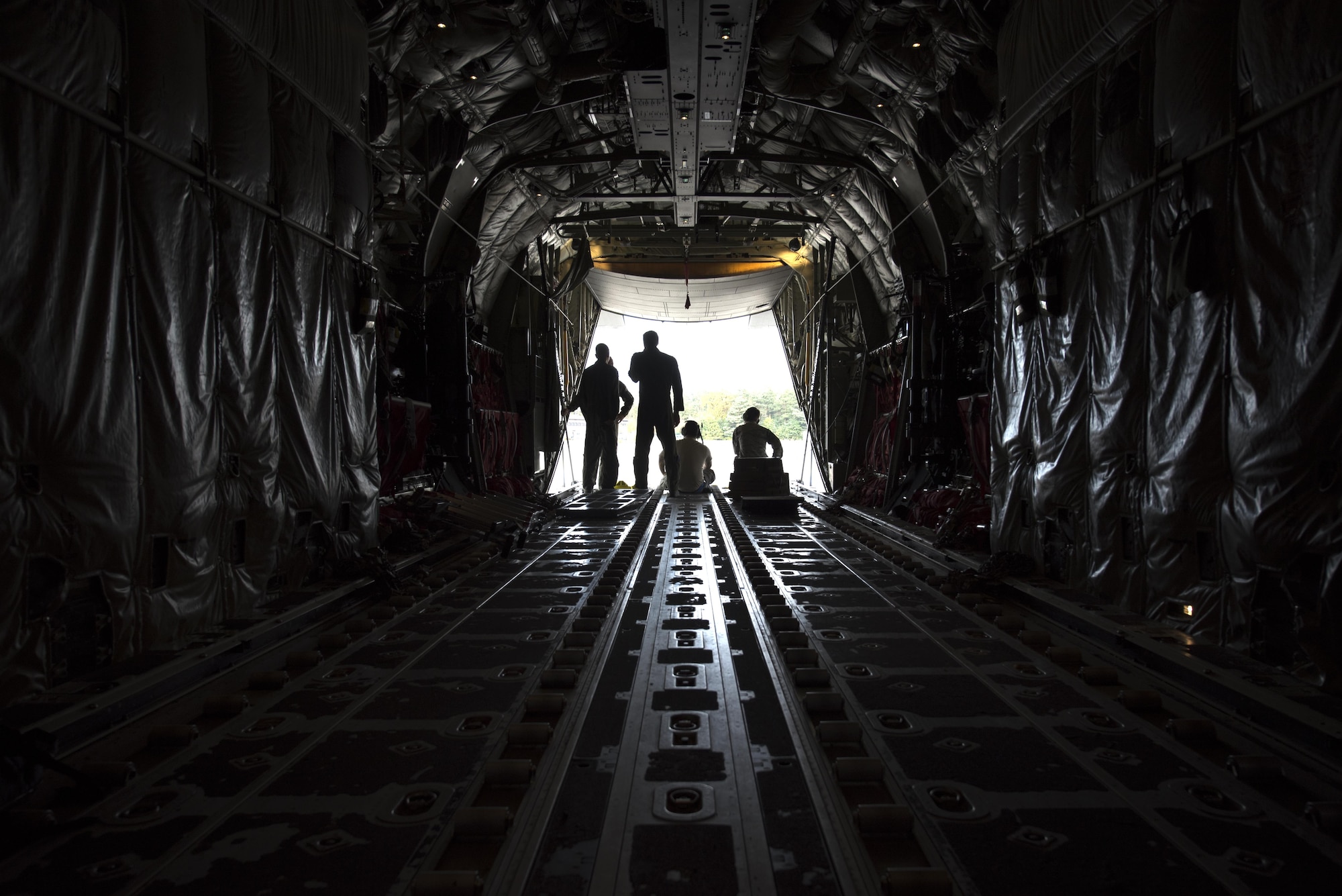 U.S. Airmen assigned to the 86th Aircraft Maintenance Squadron and 37th Airlift Squadron sit in a C-130J Super Hercules during taxi to a parking spot on Ramstein Air Base, Germany, Oct. 13, 2017. Crew chiefs work hand in hand with pilots to ensure all the issues that arise with the aircraft are resolved. (U.S. Air Force photo by Airman 1st Class Devin M. Rumbaugh)