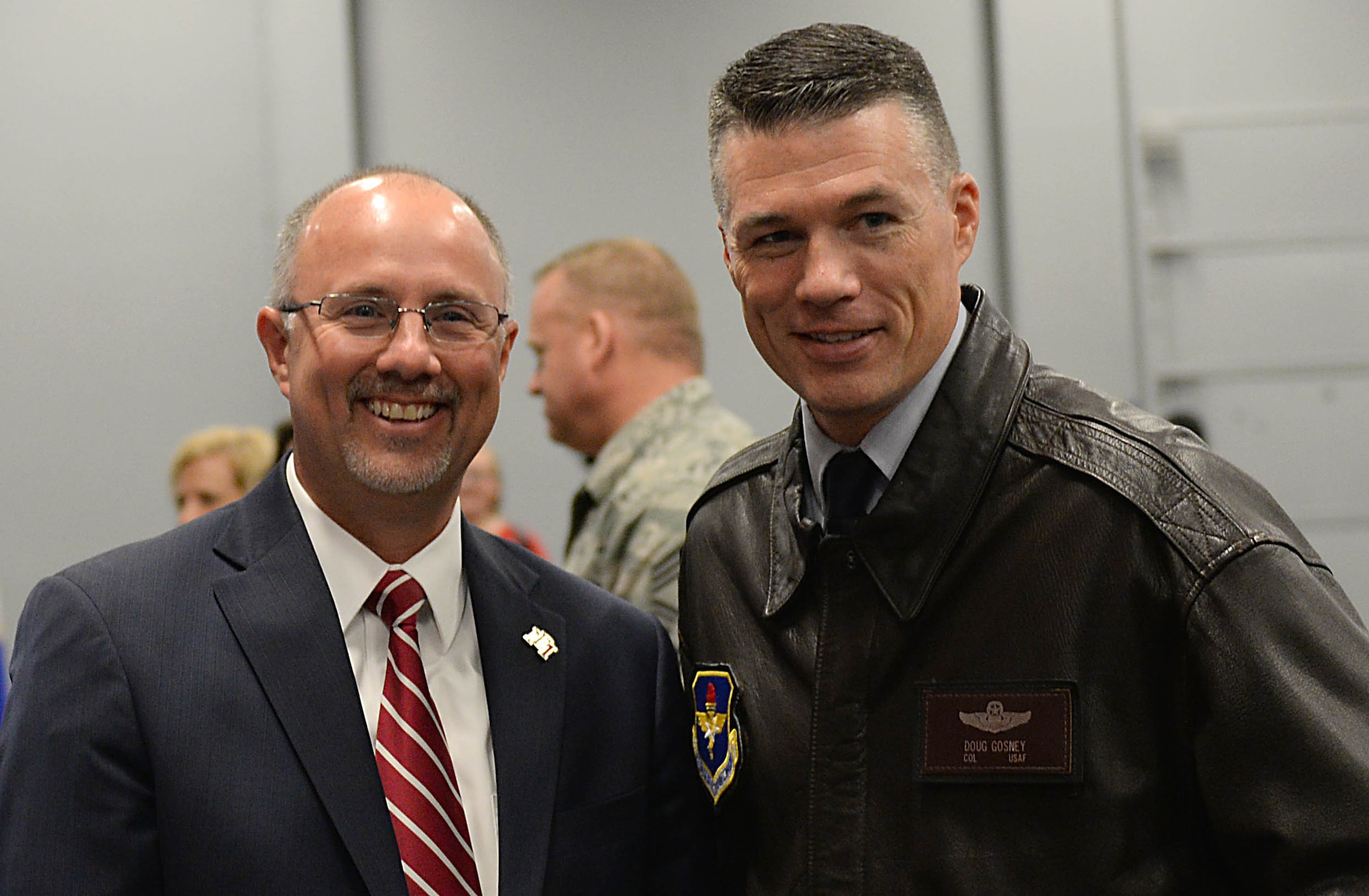 Dr. Thomas Huebner, President of East Mississippi Community College, and Col. Douglas Gosney, 14th Flying Training Wing Commander, talk during the Proud to be an American event Nov. 7, 2017, on the EMCC campus in Mayhew, Mississippi. Gosney spoke about the reasons he is proud to be an American and explained the many types of heroes America has outside of the Department of Defense. (U.S. Air Force photo by Airman 1st Class Keith Holcomb)