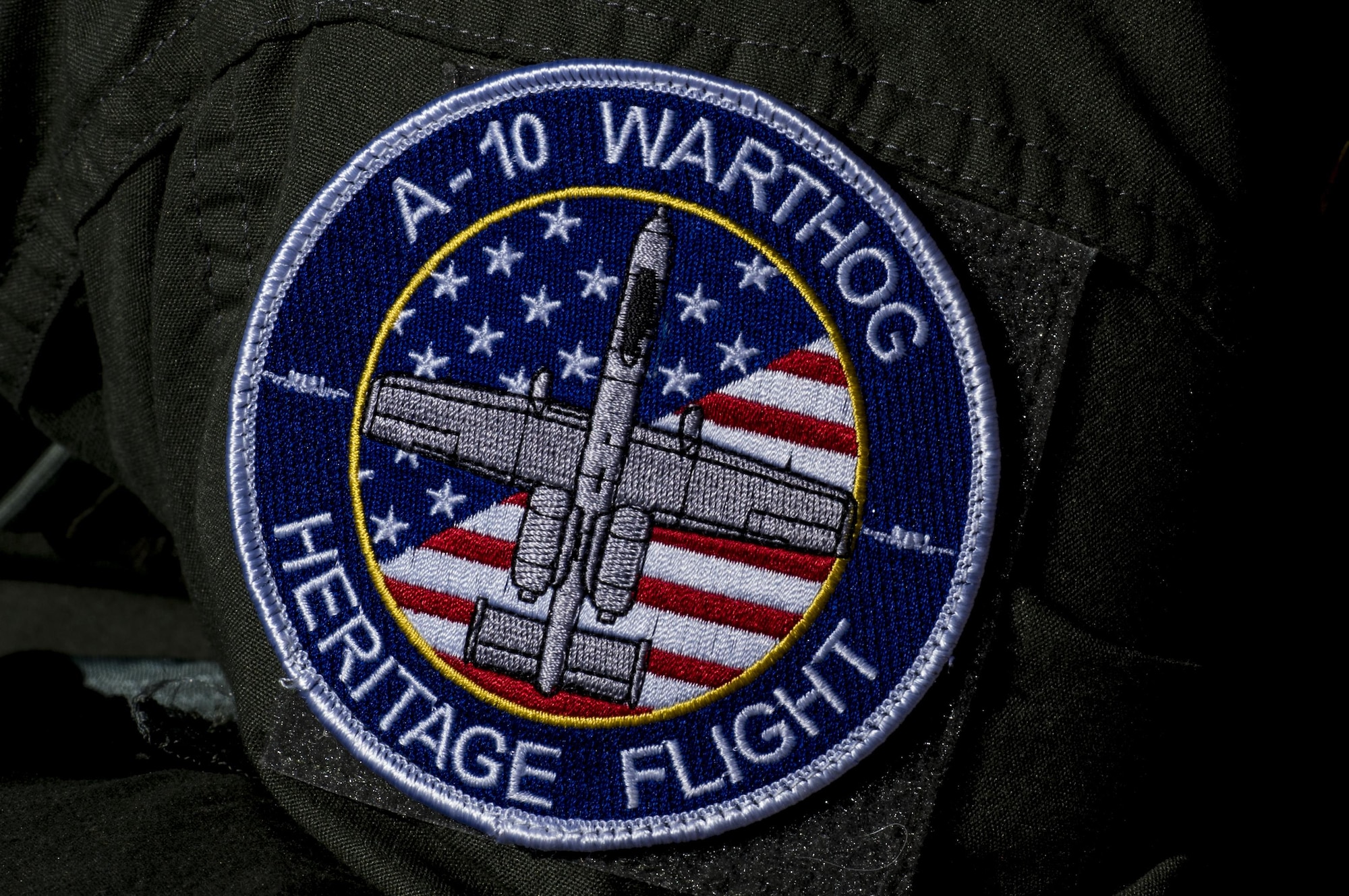 The A-10 Heritage Flight patch rests on the shoulder of Maj. Joseph Morrin, A-10 Heritage Flight Team pilot, during the Naval Air Station Jacksonville Air Show, Nov. 2, 2017, at NAS Jacksonville, Fla. The U.S. Air Force Heritage Flight program showcases past, present and future aircraft to spectators at air shows around the world. (U.S. Air Force photo by Staff Sgt. Eric Summers Jr.)