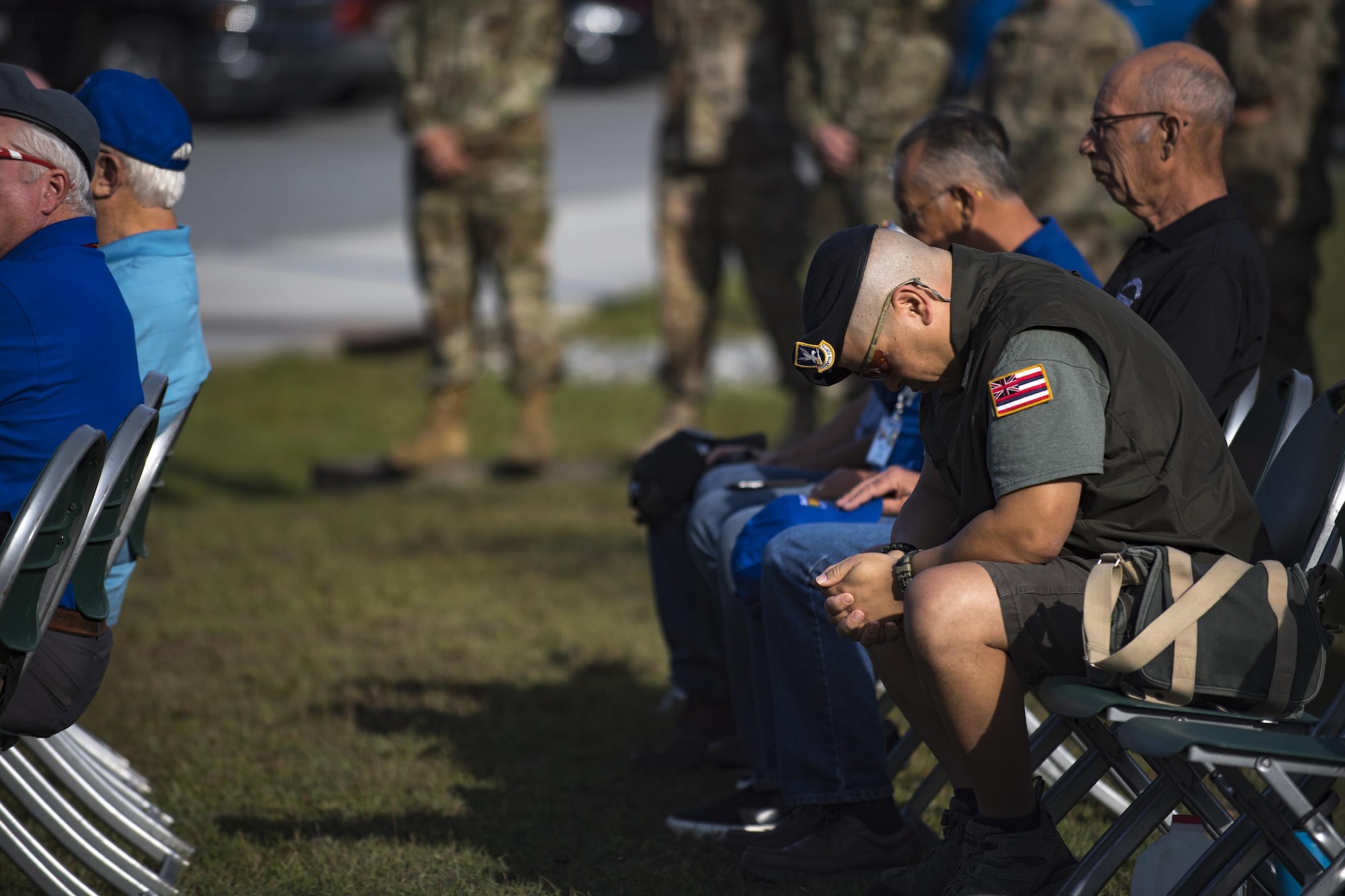 Retired Master Sgt. Baron Acosta puts his head down for a moment during a Safeside memorial service, Nov. 8, 2017, at Moody Air Force Base, Ga. Safeside reunions are biennial and scheduled around the 820th Base Defense Group’s high-ops tempo. (U.S. Air Force photo by Senior Airman Daniel Snider)