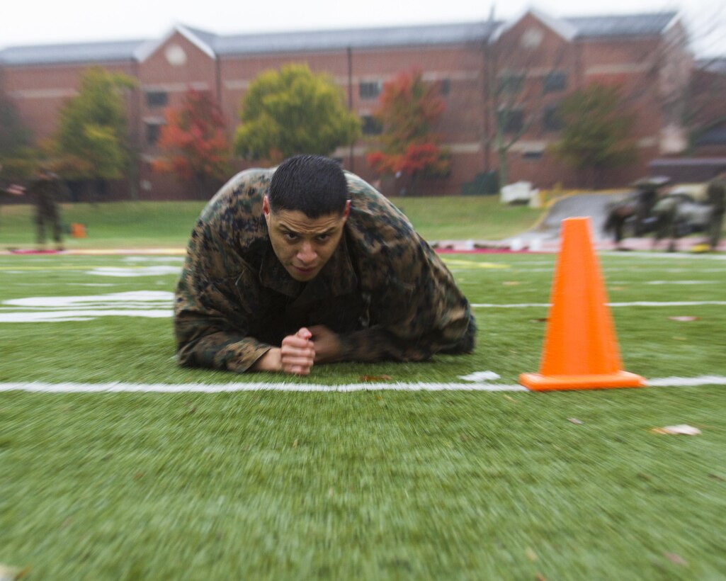 Sergeant Edward Aguirre, an operations clerk for the Marine Corps Recruiting Command, performs his Combat Fitness Test (CFT) at Barnett Field on Marine Corps Base Quantico, Virginia, November 7, 2017. Marines must perform a CFT every year, composed of a 880-yard sprint, ammunition can lifts for two minutes, and a simulated maneuver-under-fire, where Marines complete combat-related obstacles. Marine Corps Bulletin 6100 announced that Marines may retake the CFT as many times as they wish in order to improve their scores from July through December.