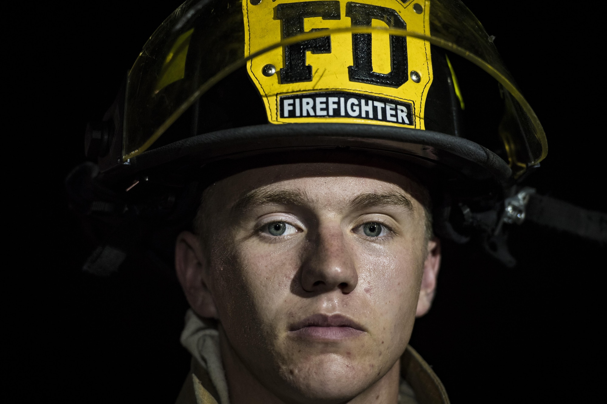Airman 1st Class Austin Taylor, 23d Civil Engineer Squadron firefighter, poses for a photo during nighttime live-fire training, Nov. 9, 2017, at Moody AFB, Ga. Moody and the Valdosta Fire Department joined forces to prepare for the possibility of nighttime aircraft fire operations.  (U.S. Air Force photo by Senior Airman Janiqua P. Robinson)