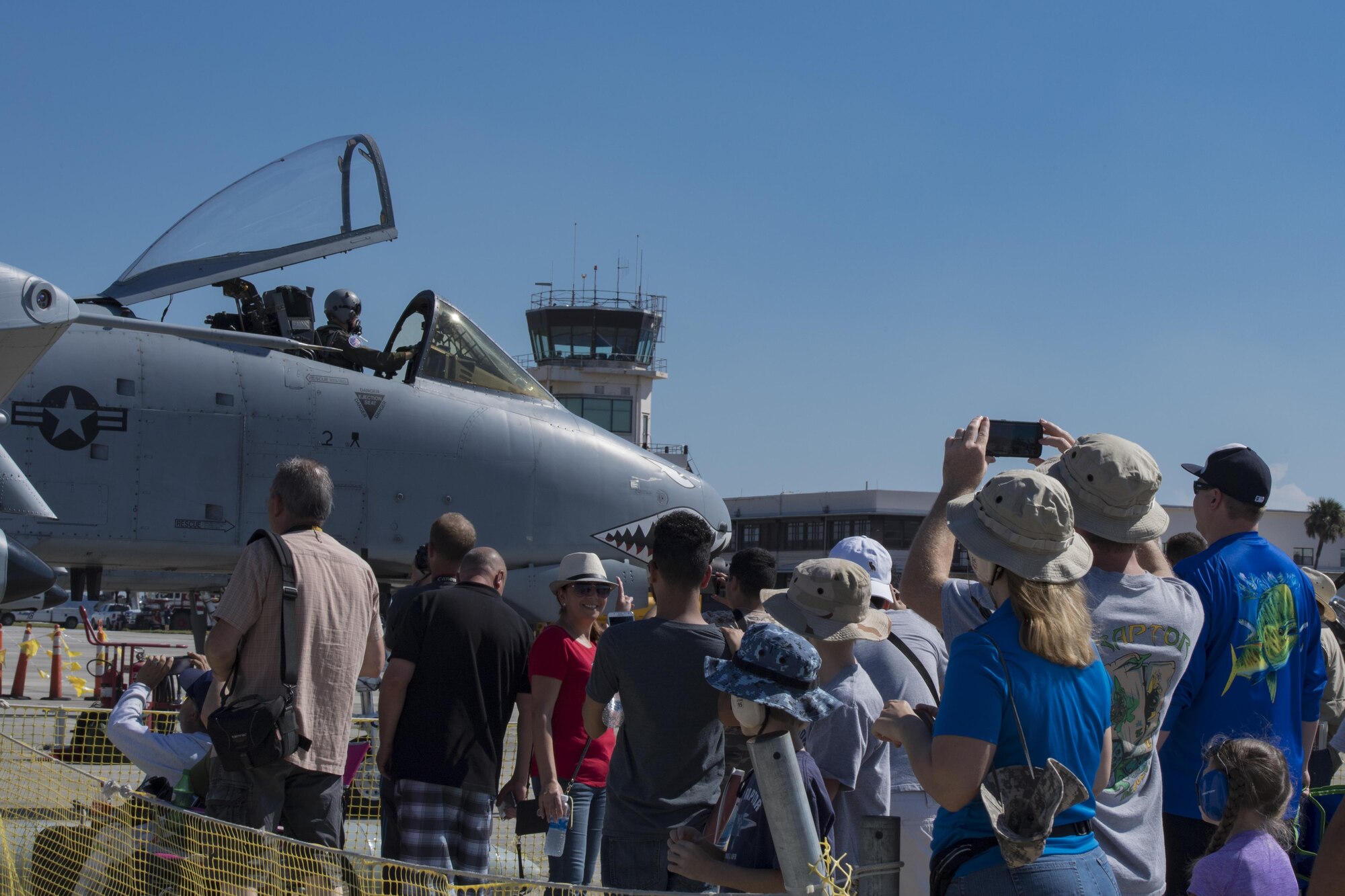 A crowd at the Naval Air Station Jacksonville Air Show watches and applauds as an A-10C Thunderbolt II parks after performing in a heritage flight, Nov. 4, 2017, at NAS Jacksonville, Fla. The U.S. Air Force Heritage Flight program showcases past, present and future aircraft to spectators at air shows around the world. (U.S. Air Force photo by Staff Sgt. Eric Summers Jr.)