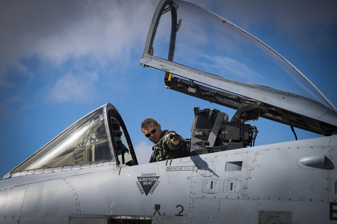 Maj. Joseph Morrin, A-10 Heritage Flight Team pilot, points to team members before taking off, Nov. 5, 2017, at Naval Air Station Jacksonville, Fla. The U.S. Air Force Heritage Flight program showcases past, present and future aircraft to spectators at air shows around the world. (U.S. Air Force photo by Staff Sgt. Eric Summers Jr.)