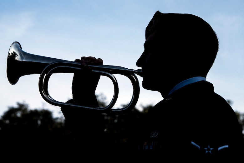 An Airmen from the 820th Base Defense Group plays a bugle during a Safeside reunion memorial, Nov.8, 2017, at Moody Air Force Base, Ga.  Biennially, the Safeside Association holds a reunion to interact with and honor their past and present comrades from the 820th Base Defense Group. (U.S. Air Force photo by Airman Eugene Oliver)