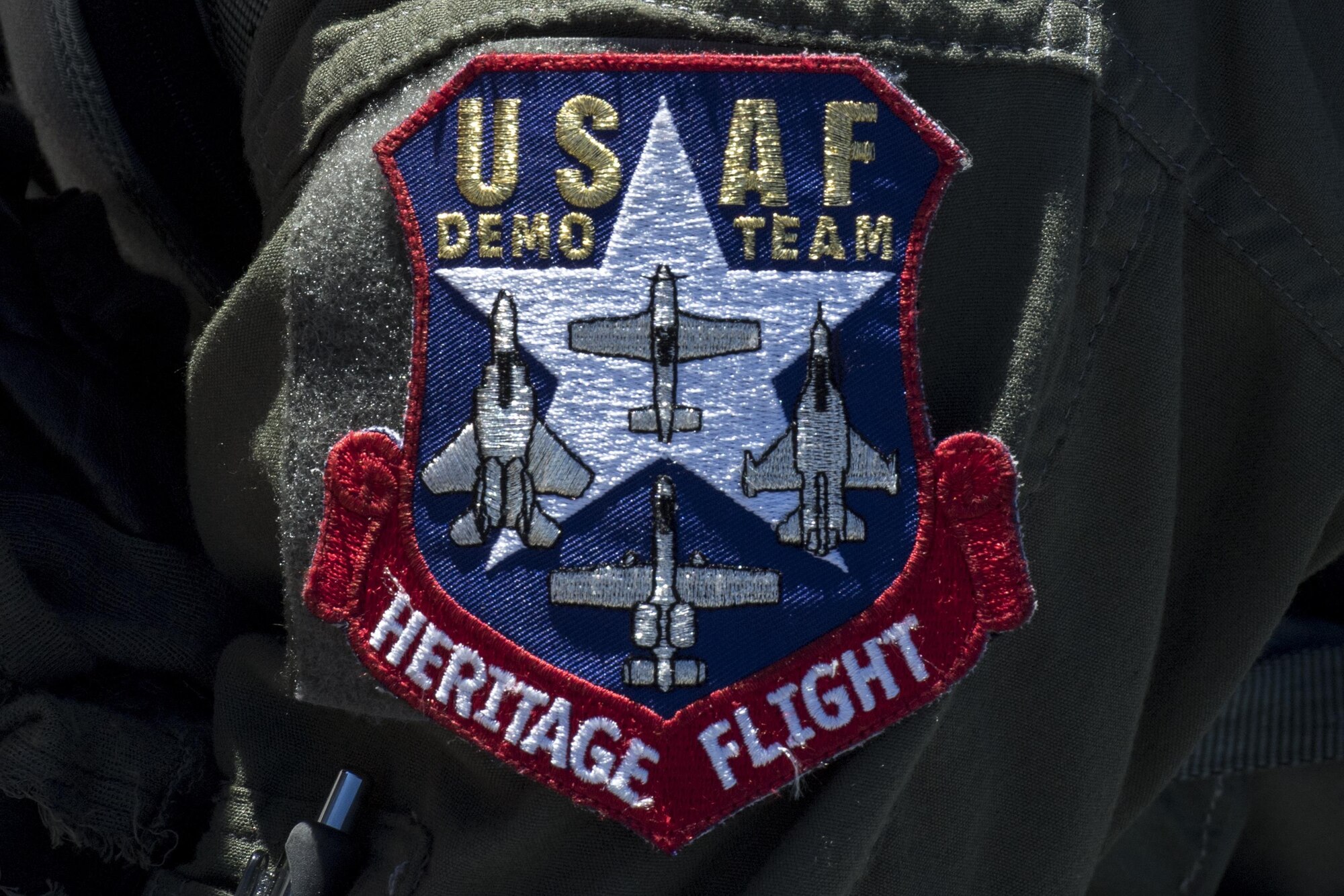 The United States Air Force Heritage Flight patch rests on the shoulder of Maj. Joseph Morrin, A-10 Heritage Flight Team pilot, during the Naval Air Station Jacksonville Air Show, Nov. 2, 2017, at NAS Jacksonville, Fla. The U.S. Air Force Heritage Flight program showcases past, present and future aircraft to spectators at air shows around the world. (U.S. Air Force photo by Staff Sgt. Eric Summers Jr.)