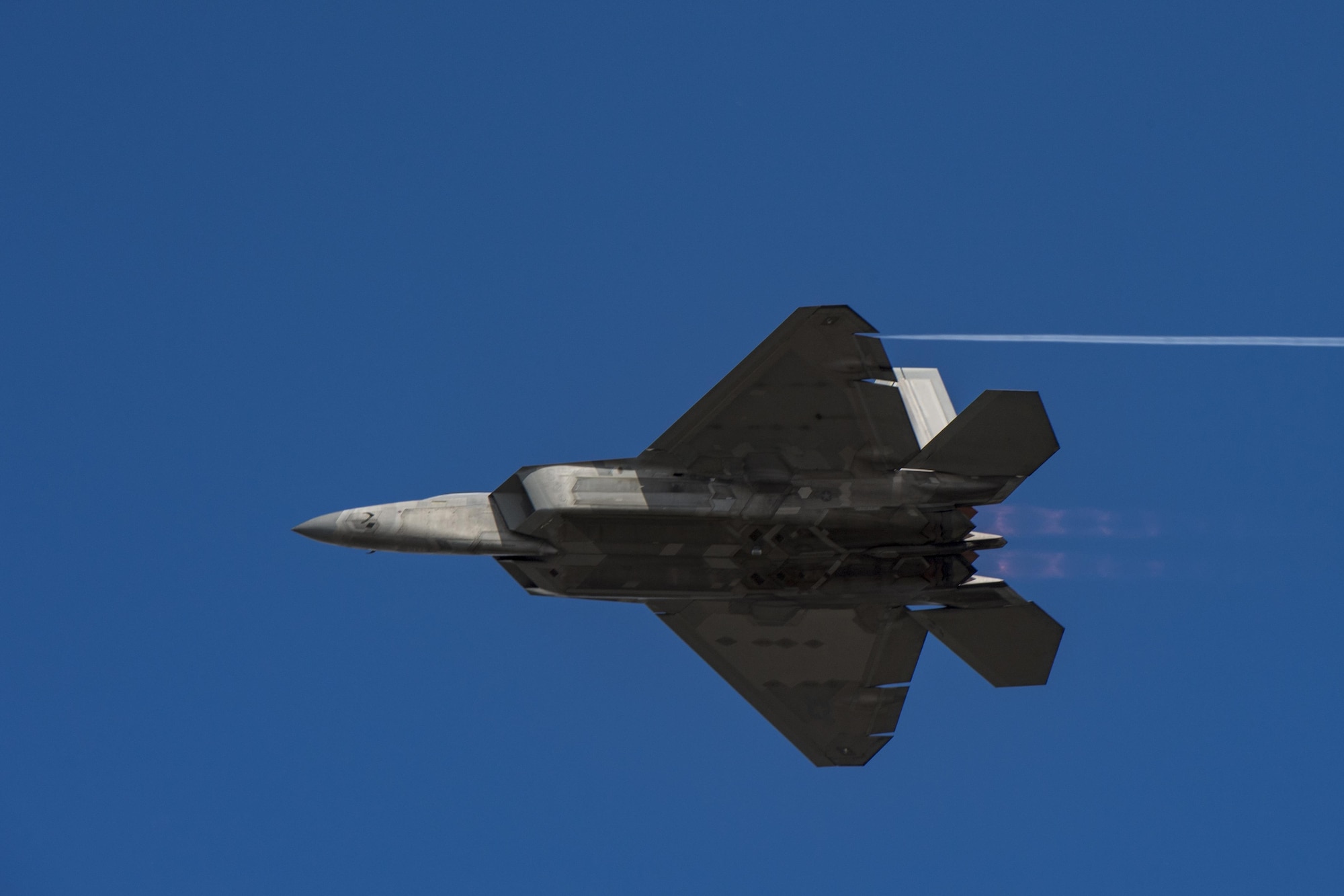 An F-22 Raptor performs a speed pass demonstrating a fraction of its top speed Nov. 5, 2017, at Naval Air Station Jacksonville, Fla. Maj. Daniel Dickinson, F-22 Raptor Demo Team pilot, performed display of capabilities before joining the Heritage Flight Formation. (U.S. Air Force photo by Staff Sgt. Eric Summers Jr.)