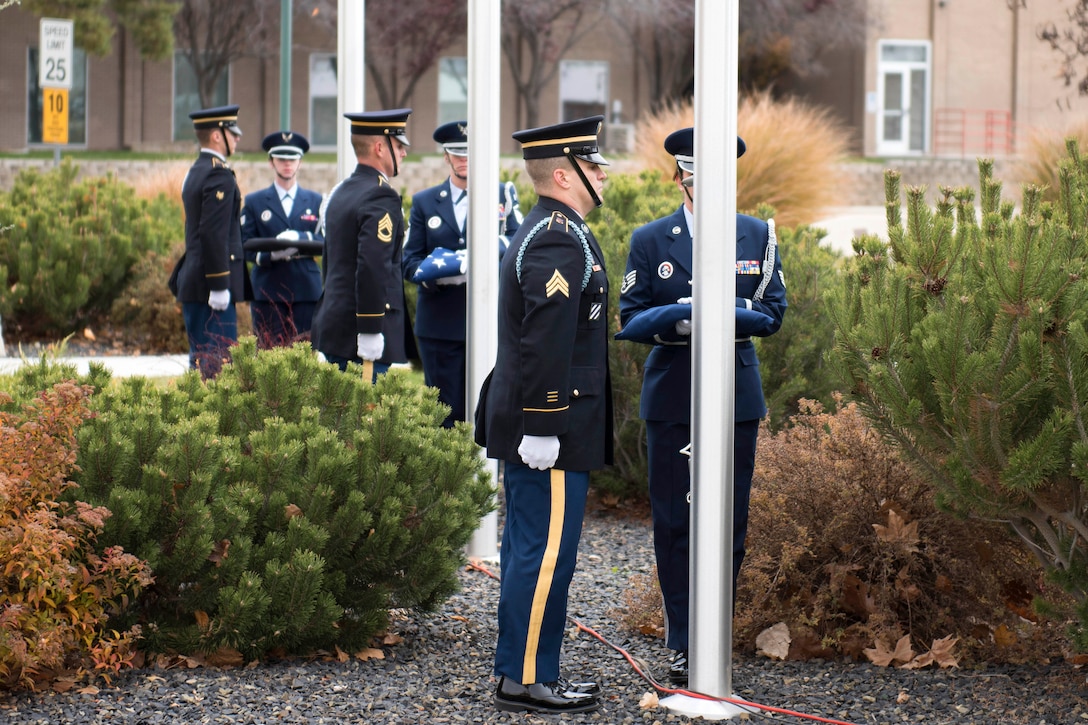 Idaho National Guardsmen prepare to present the colors during a Veterans Day ceremony.