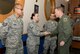 U.S. Air Force Gen. Tod D. Wolters, U.S. Air Forces in Europe and Air Forces Africa commander, coins U.S. Air Force Staff Sgt. Amy Daugherty, 100th Maintenance Group, at RAF Mildenhall, England, Nov. 9, 2017. During his visit, Wolters recognized outstanding Airmen from the 100th Air Refueling Wing and expressed his appreciation for their hard work. (U.S. Air Force photo by Senior Airman Tenley Long)