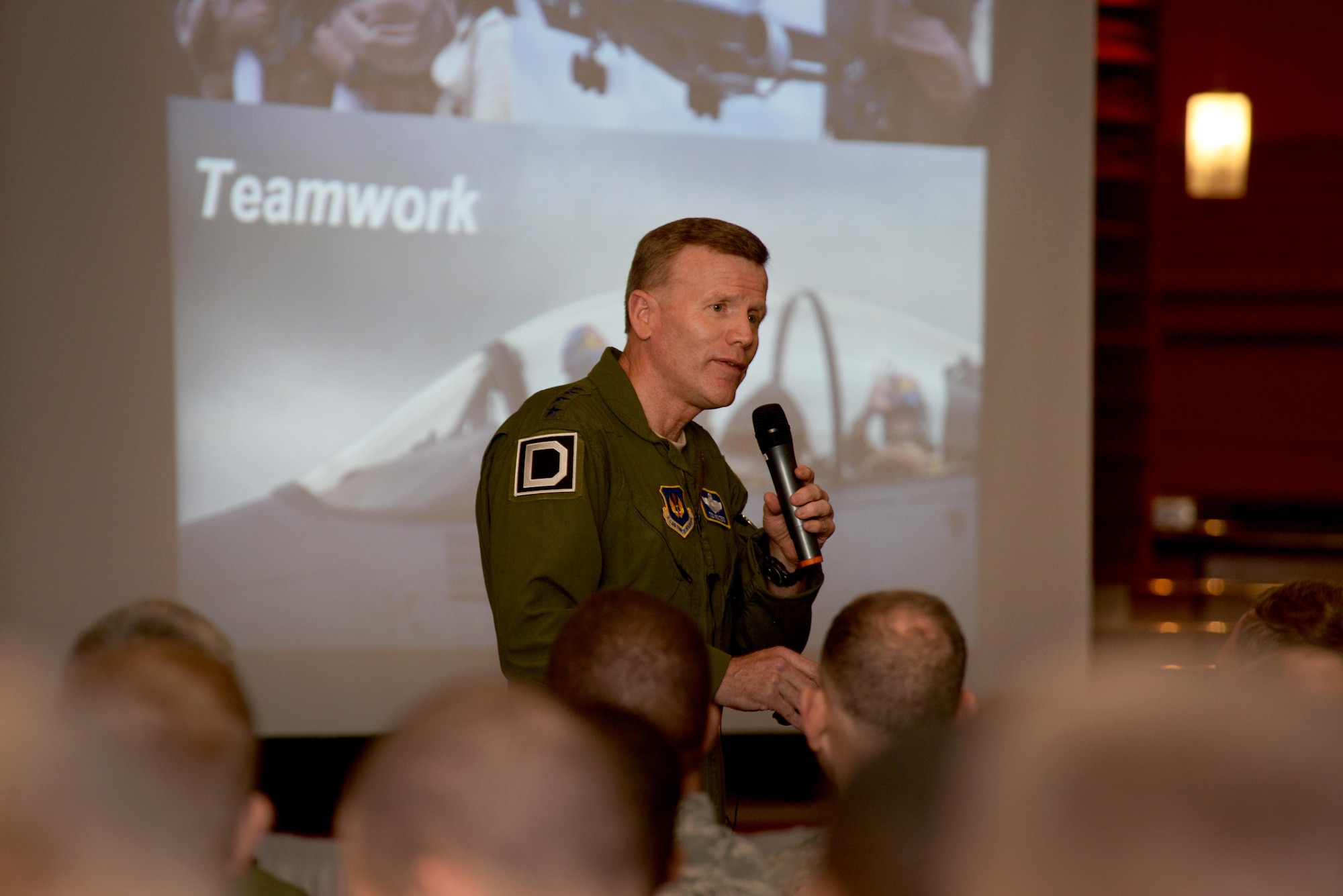 U.S. Air Force Gen. Tod D. Wolters, U.S. Air Forces in Europe and Air Forces Africa commander, speaks to Airmen of the 'Bloody Hundredth' during an all call at RAF Mildenhall, England, Nov. 9, 2017. During the all call, Wolters stressed the significance of the 100th Air Refueling Wing's role in the Air Force's mission in Europe and Africa. (U.S. Air Force photo by Senior Airman Tenley Long)