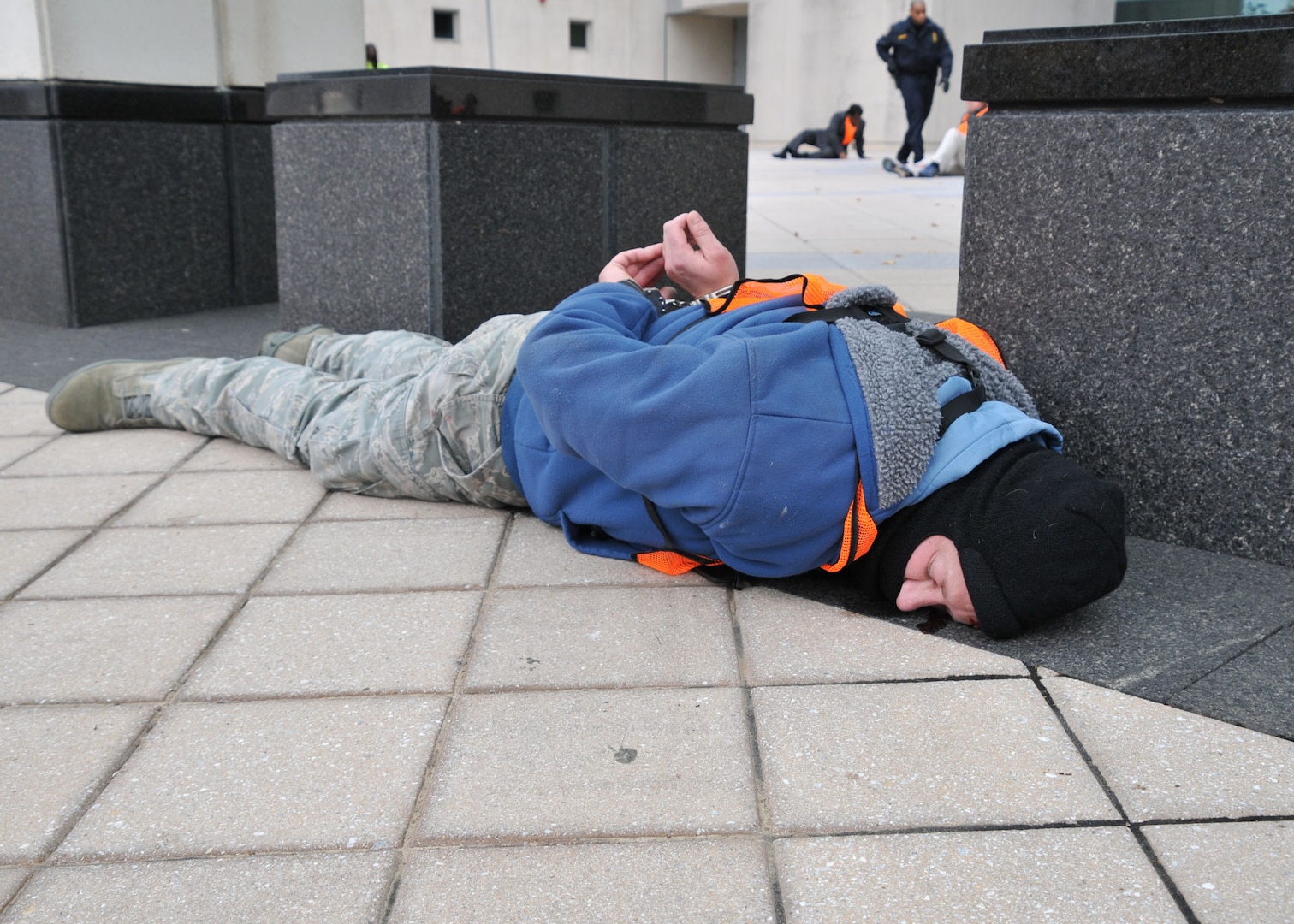 'Victim' played by employee lies prone as part of exercise.