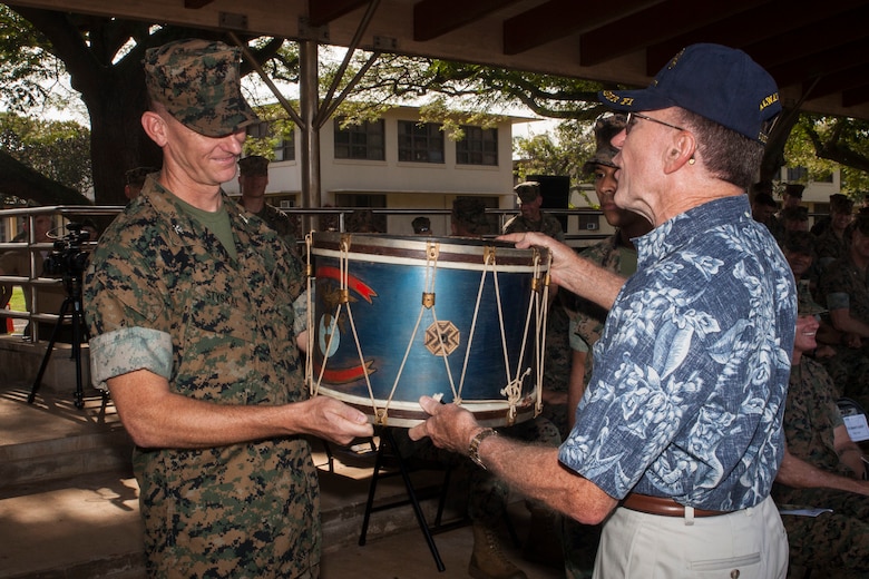 Col. Michael Styskal, the commanding officer of 3rd Marine Regiment, is presented a ceremonial battle drum from a Naval Order of the United States representative during a Battle Colors Ceremony commemorating Bougainville Day, Marine Corps Base Hawaii, Nov. 1, 2017. Bougainville Day is the 75th Anniversary of the unit and 74th anniversary of the Battle of Bougainville. The battle happened on Nov. 1, 1943, when 3rd Marines landed at Empress Augusta Bay, Bougainville, to establish a beachhead, fending off thousands of Imperial Japanese soldiers.  (U.S. Marine Corps photo by Cpl. Jesus Sepulveda Torres)
