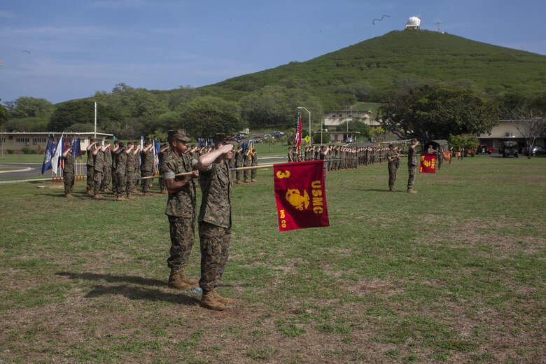 U.S. Marines with 3rd Marine Regiment salute and present their unit colors during a battle color ceremony for Bougainville Day, Marine Corps Base Hawaii, Nov. 1, 2017. Bougainville Day is the 75th Anniversary of the unit and 74th anniversary of the Battle of Bougainville. The battle happened on Nov. 1, 1943, when 3rd Marines landed at Empress Augusta Bay, Bougainville, to establish a beachhead, fending off thousands of Imperial Japanese soldiers. (U.S. Marine Corps photo by Cpl. Jesus Sepulveda Torres)