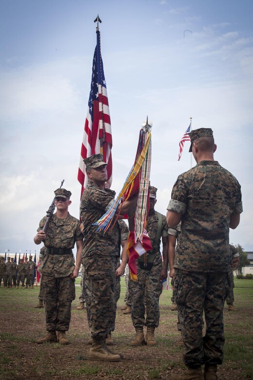 Col. Michael Styskal (right), the 3rd Marine Regiment commanding officer, prepares to attach unit campaign streamers onto the regiment’s colors during a battle colors ceremony for Bougainville Day, Marine Corps Base Hawaii, Nov. 1, 2017. Bougainville Day is the 75th Anniversary of the unit and 74th anniversary of the Battle of Bougainville. The battle happened on Nov. 1, 1943, when 3rd Marines landed at Empress Augusta Bay, Bougainville, to establish a beachhead, fending off thousands of Imperial Japanese soldiers. (U.S. Marine Corps photo by Cpl. Jesus Sepulveda Torres)
