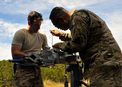 Tech. Sgt. Brenden McAvey, left, 315th Civil Engineer Squadron Explosive Ordnance Disposal craftsman, adjusts the laser sight on the REMOTEC Andros F6A robot with the help of Tech. Sgt. Patrick Puckhaber, right, 315th CES EOD craftsman, at the Joint Base Charleston Naval Weapons Station EOD range, S.C., Nov. 2, 2017.