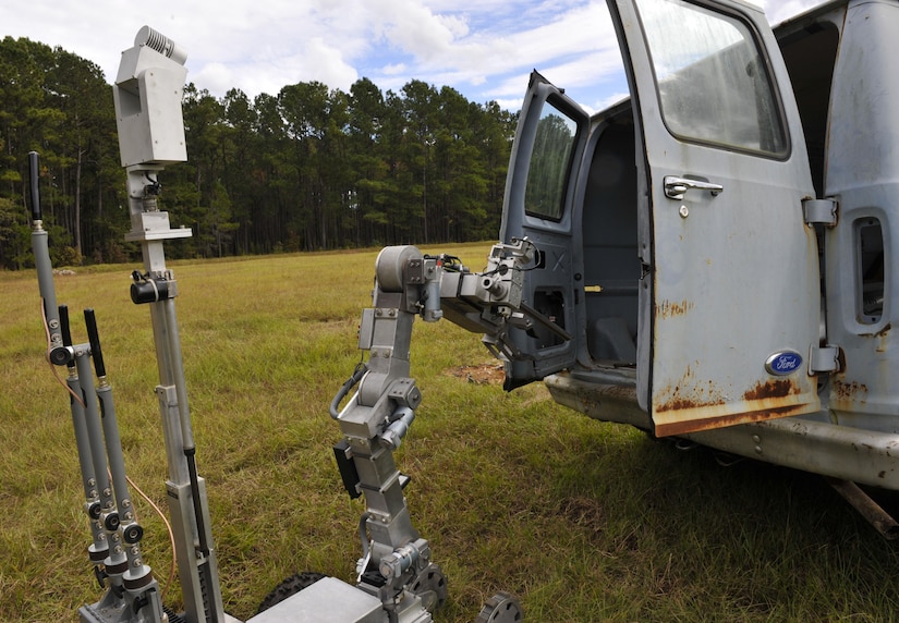 A REMOTEC Andros F6A robot opens the doors of a “suspicious” van during a routine training exercise at the Joint Base Charleston Naval Weapons Station Explosive Ordnance Disposal range, S.C., Nov. 2, 2017.