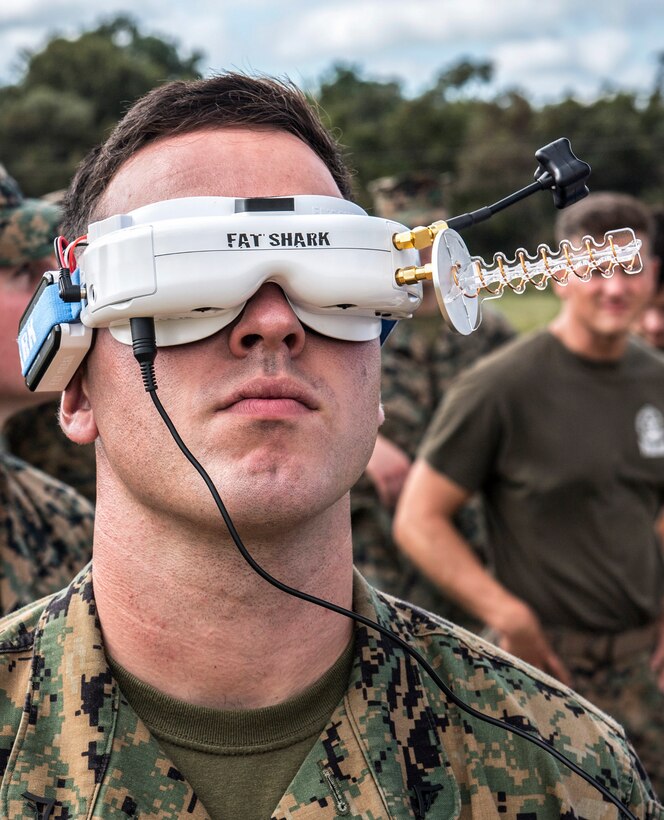 A Marine wears a 3-D printed Army drone over his eyes to see what it sees.