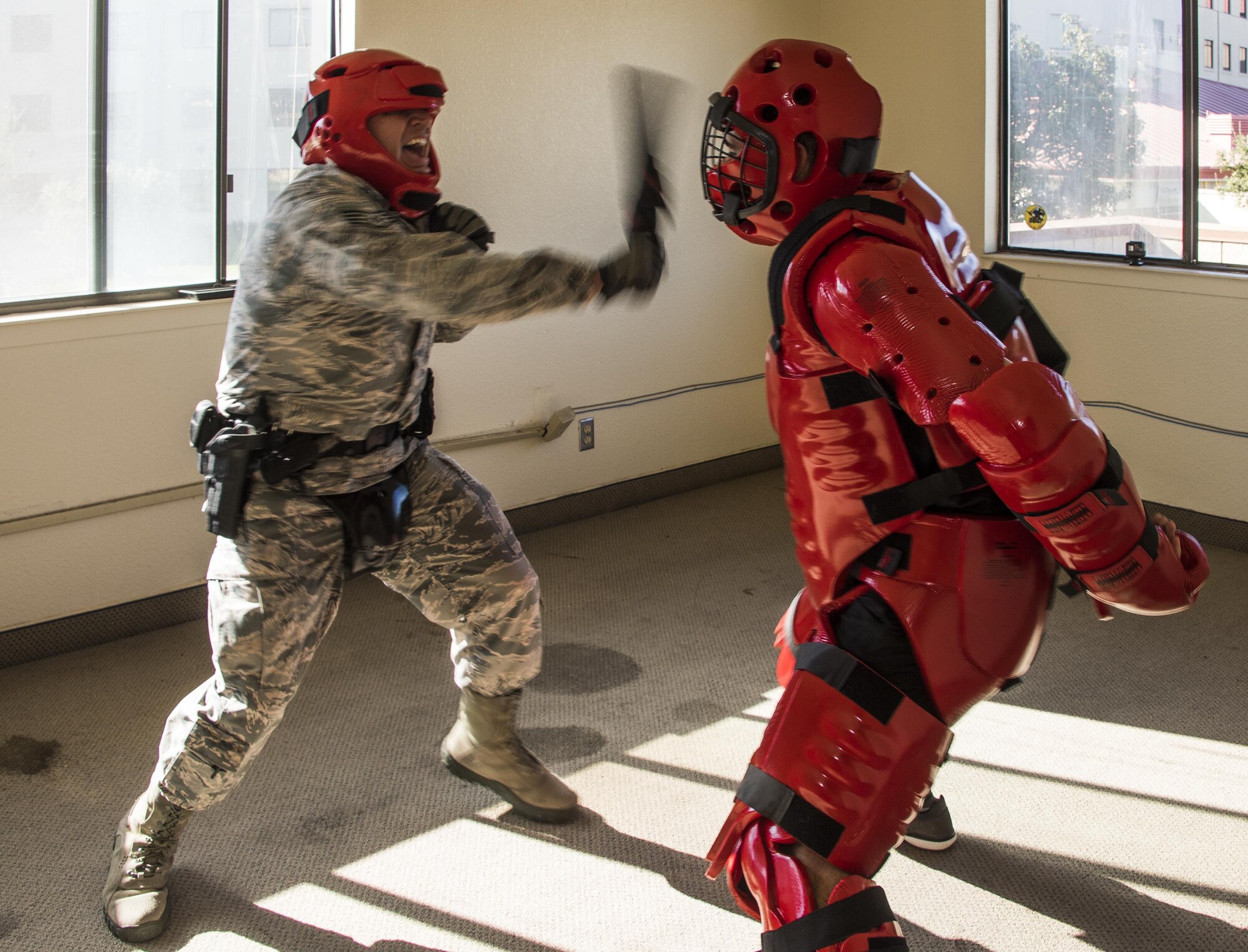 U.S. Air Force Staff Sgt. Jamie Tovar, 60th Security Forces Squadron, tries to take down the “Redman” during Defender Annual Refresher crucible training, Oct. 27, Travis Air Force Base, Calif.  60th SFS team members go through a 30-day period of intense training for the DART program. The teams of specially trained security forces personnel are dedicated to providing security for terrorist and criminal threat areas