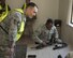U.S. Air Force Airman 1st Class Christopher Boone with 60th Security Forces Squadron, has minutes to dissemble and reassemble a weapon while answering questions being rapidly asked by an instructor during Defender Annual Refresher crucible training, Oct. 27, Travis Air Force Base, Calif.  60th SFS team members go through a 30-day period of intense training for the DART program. The teams of specially trained security forces personnel are dedicated to providing security for terrorist and criminal threat areas.