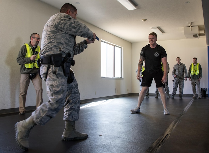 U.S. Air Force Staff Sgt. Jamie Tovar, 60th Security Forces Squadron successfully neutralizes the instructor during Defender Annual Refresher crucible training, Oct. 27, Travis Air Force Base, Calif.  60th SFS team members go through a 30-day period of intense training for the DART program. The teams of specially trained security forces personnel are dedicated to providing security for terrorist and criminal threat areas.