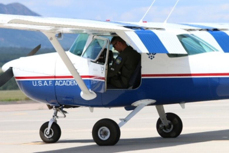Cadet First Class Patrick Neff prepares to start the T-51 Deathhawk engine. (U.S. Air Force photo by C3C Josiah Bierle)