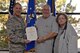 With his wife Virginia by his side, Edward Keller is presented his 50-year service certificate by Lt. Gen. Lee K Levy II, Air Force Sustainment Center commander, on Nov. 2, 2017 at Hill Air Force Base, Utah. (U.S. Air Force Photo by Alex R. Lloyd)