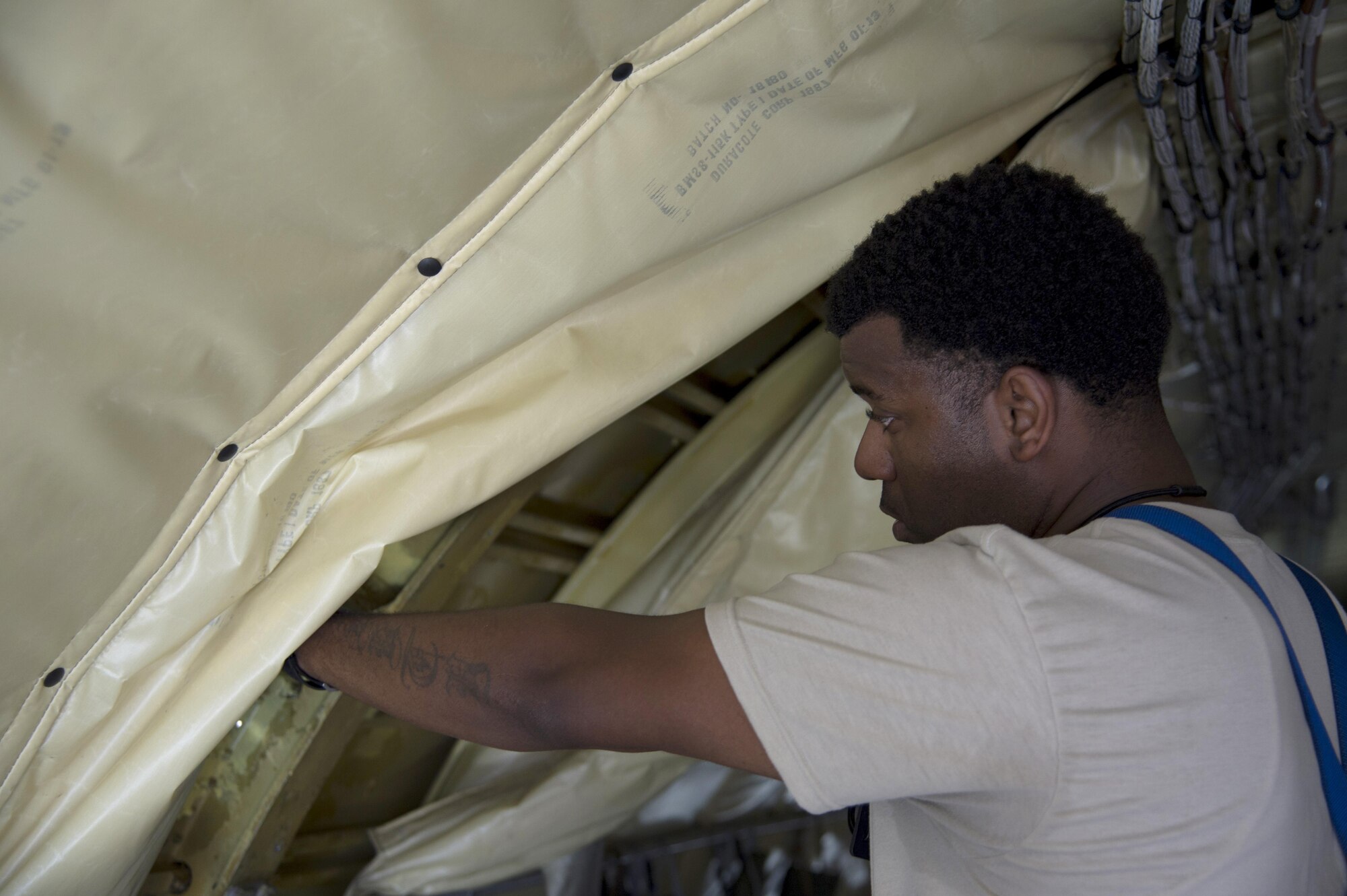 U.S. Air Force Tech. Sgt. Markas Williams, NCO in charge of the non-destructive inspection lab assigned to the 6th Maintenance Squadron, inspects a bulkhead on a KC-135 Stratotanker aircraft before using an X-ray machine at MacDill Air Force Base, Fla., Nov. 7, 2017.