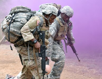 Staff Sgt. Lionel Semon and Sgt. Rolando Fender, assigned to the Airborne and Ranger Training Brigade drag an injured Soldier out of harms way during the tactical combat casualty care (TC3) lane.