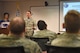 Master Sgt. Lance Hasz, 92nd Force Support Squadron Career Assistance Advisor, talks with Airmen during an Informed Decision Briefing Oct. 27, 2017, at Fairchild Air Force Base, Washington. Hasz is one of less than 100 CAAs Air Force-wide. His position focuses on three vital aspects: customer service, regulated courses such as FTAC and professional development. (U.S. Air Force photo/Senior Airman Mackenzie Richardson)