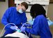 Capt. John Ensley, 14th Medical Operations Squadron General Dentist, and Shaneka Hubbard, 14th MDOS dental assistant, operate on a patient Nov. 3, 2017, on Columbus Air Force Base, Mississippi. The 14th MDOS Dental Flight has two dentists to provide care for the entire base population as well as Guard and Reserve units. (U.S. Air Force photo by Airman 1st Class Beaux Hebert)