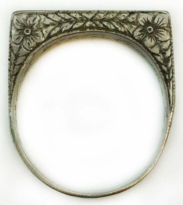 WWI Artifact-This ring reads “A OF A.”  Captain E.V. Rickenbacker was called America’s Ace of Aces, due to his accruing the highest number of American aerial victories against the Germans during World War I— 26.