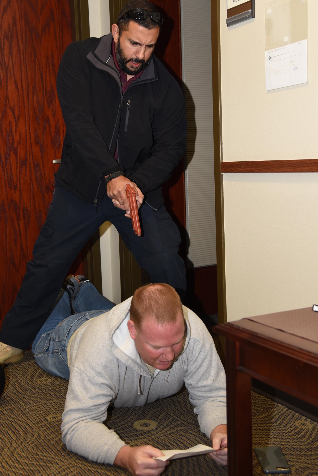 enemy pointing gun at good guy