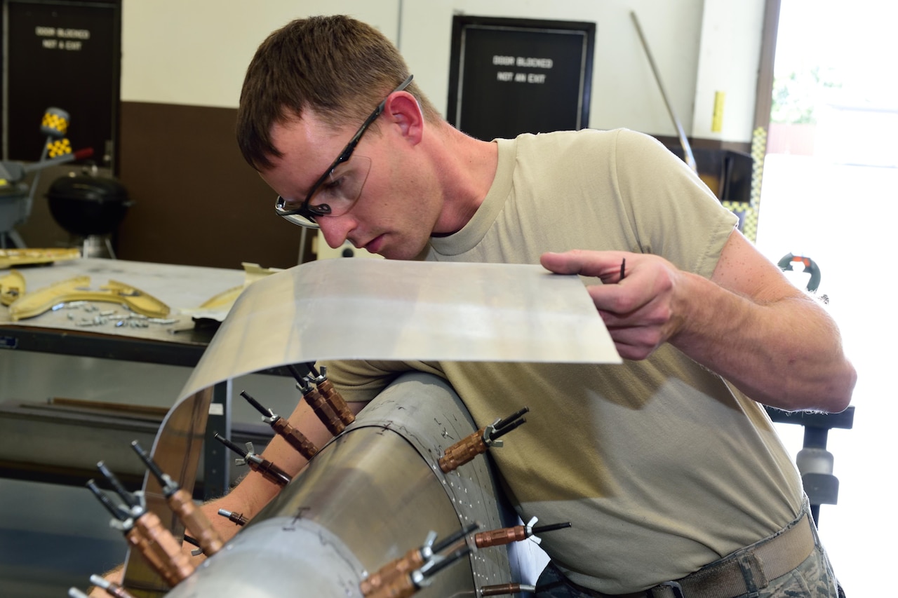 Staff Sgt. Cody Seymour, 403rd Fabrication Flight aircraft structural maintenance technician, patches the outer skin of the leading edge for the wing of a C-130J Super Hercules at Keesler Air Force Base, Mississippi, Oct. 24, 2017. Seymour also works for the flight in the same capacity as an air reserve technician, performing his Air Force Reserve job as full-time civil service employee for the Department of Defense. (U.S. Air Force photo by Tech. Sgt. Ryan Labadens)