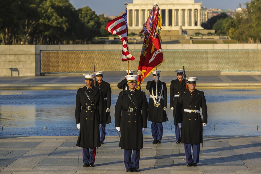 A parade marching staff with Marine Barracks Washington D.C. stands at the position of attention during the Marine Corps’ Birthday Wreath Laying Ceremony at the World War II Memorial, Washington D.C., Nov. 10, 2017. The wreath laying ceremony is an annual event held to celebrate the U.S. Marine Corps’ birthday and honor those who gave the last measure of devotion to country and Corps. (Official U.S. Marine Corps photo by Cpl. Damon A. Mclean/Released)