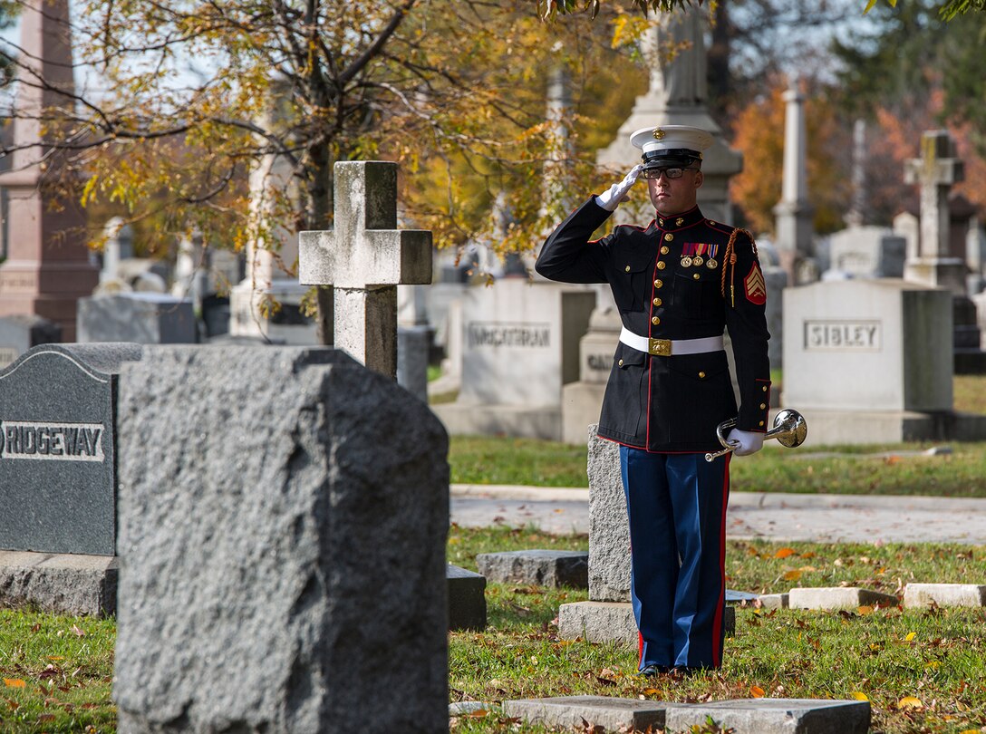 Sergeant Kyle Menz, bugler, “The Commandant’s Own” U.S. Marine Drum & Bugle, renders honors after performing Taps during a wreath laying ceremony at the Congressional Cemetery, Washington D.C., Nov. 10, 2017. The wreath laying ceremony is an annual event held to celebrate the U.S. Marine Corps’ birthday and honor those who gave the last full measure of devotion to country and Corps. (Official U.S. Marine Corps photo by Cpl. Robert Knapp/Released)