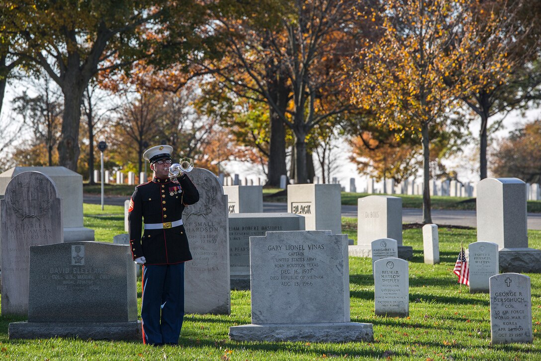 Sergeant Kyle Menz, bugler, “The Commandant’s Own” U.S. Marine Drum & Bugle, plays Taps during a wreath laying ceremony at Arlington National Cemetery, Arlington, Va., Nov. 10, 2017. The wreath laying ceremony is an annual event held to celebrate the U.S. Marine Corps’ birthday and honor those who gave the last full measure of devotion to country and Corps. (Official U.S. Marine Corps photo by Cpl. Robert Knapp/Released)