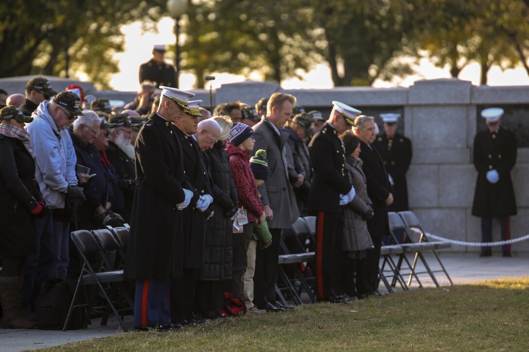 Guests attending the Marine Corps’ Birthday Wreath Laying Ceremony bow their heads as the invocation is given at the World War II Memorial, Washington D.C., Nov. 10, 2017. The wreath laying ceremony is an annual event held to celebrate the U.S. Marine Corps’ birthday and honor those who gave the last measure of devotion to country and Corps. (Official U.S. Marine Corps photo by Cpl. Damon A. Mclean/Released)