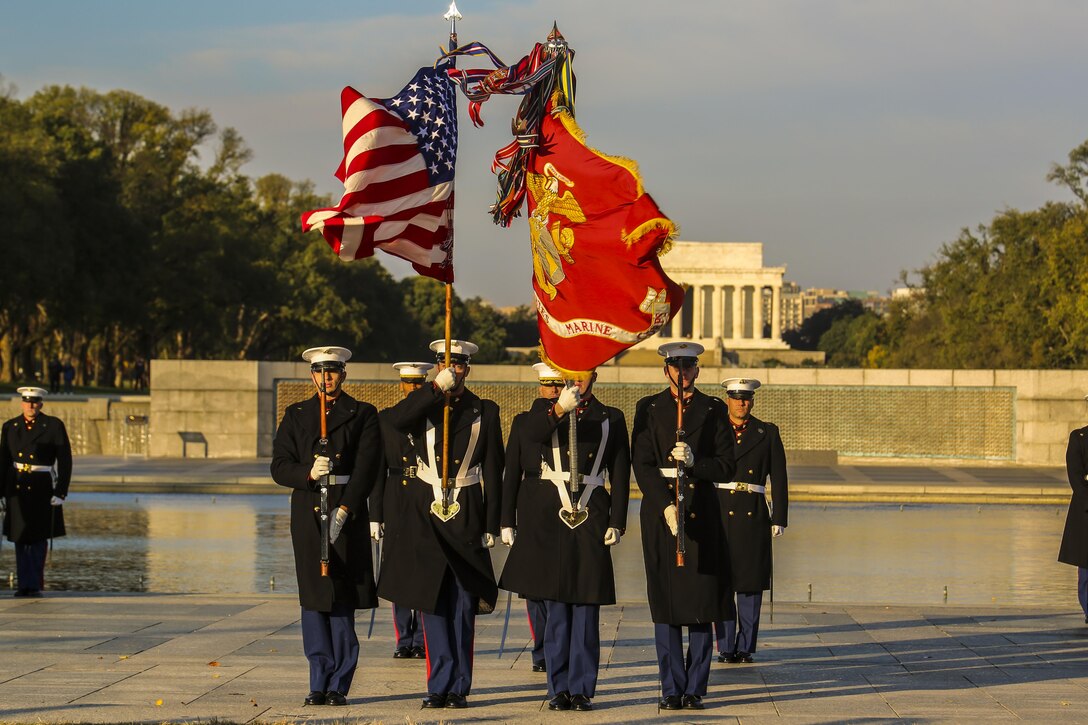 The Marine Corps Color Guard presents the National and Marine Corps Colors during the Corps’ Birthday Wreath Laying Ceremony at the World War II Memorial, Washington D.C., Nov. 10, 2017. The wreath laying ceremony is an annual event held to celebrate the U.S. Marine Corps’ birthday and honor those who gave the last measure of devotion to country and Corps. (Official U.S. Marine Corps photo by Cpl. Damon A. Mclean/Released)