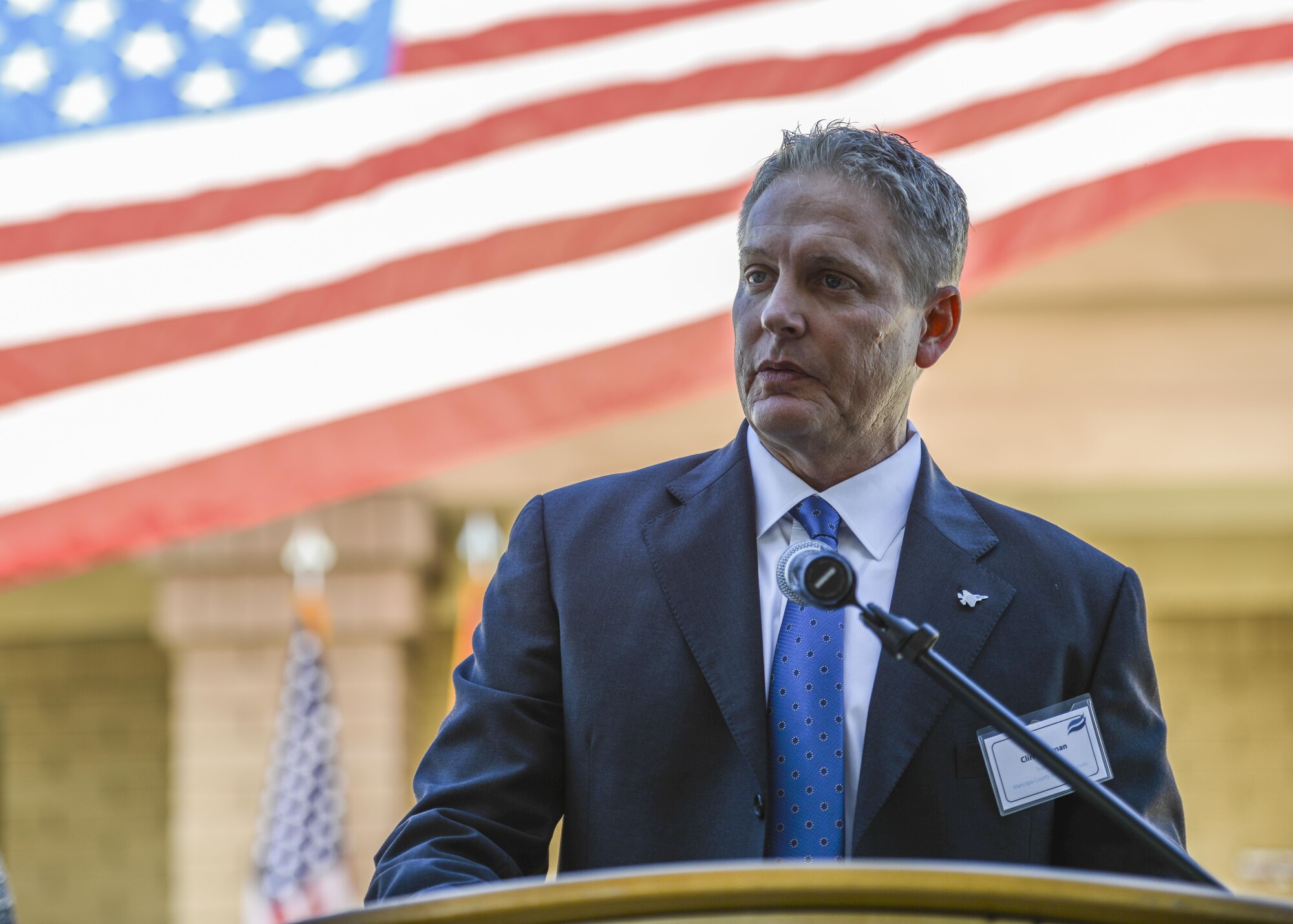 Clint Hickman, Maricopa County Board of Supervisor, speaks to a crowd of visitors at the grand opening of the Military and Veteran Success Center at Luke Air Force Base, Ariz., Nov. 9, 2017. The MVSC is a community supported, case-managed, holistic support center for transitioning service members, veterans, and their dependents. (U.S. Air Force photo/Airman 1st Class Caleb Worpel)