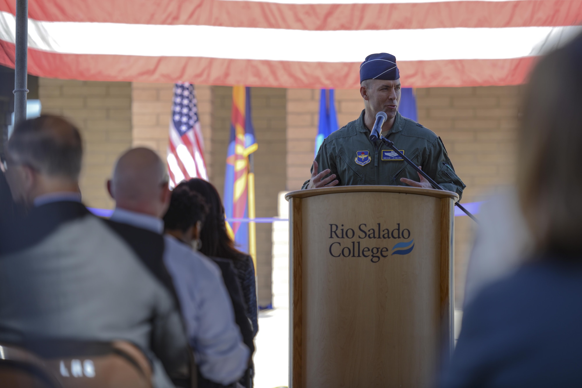 Brig. Gen. Brook Leonard, 56th Fighter Wing commander, speaks to a crowd of visitors at the grand opening of the Military and Veteran Success Center at Luke Air Force Base, Ariz., Nov. 9, 2017. The MVSC leverages the support of over 40,000 veteran supportive organizations to offer individualized resources to veterans and their dependents in employment, education, social support, physical health, housing, mental health, finances, benefit information and more. (U.S. Air Force photo/Airman 1st Class Caleb Worpel)