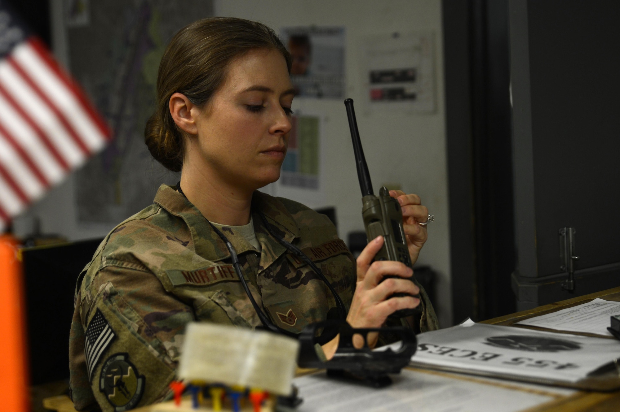 Staff Sgt. Beverly Murtiff, 455th Expeditionary Civil Engineer Squadron customer service lead, checks a radio Nov. 6, 2017 at Bagram Airfield, Afghanistan.