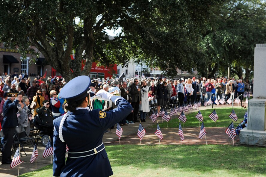 Cadet Mya Pigott, member of West Lowndes High School Air Force Junior ROTC Honor Guard, plays taps during a Veterans Day ceremony at the Lowndes County Courthouse Nov. 11, 2017, in Columbus, Mississippi. Members of the WLHS Air Force Junior ROTC also presented the colors during the ceremony. (U.S. Air Force photo by Staff Sgt. Christopher Gross)