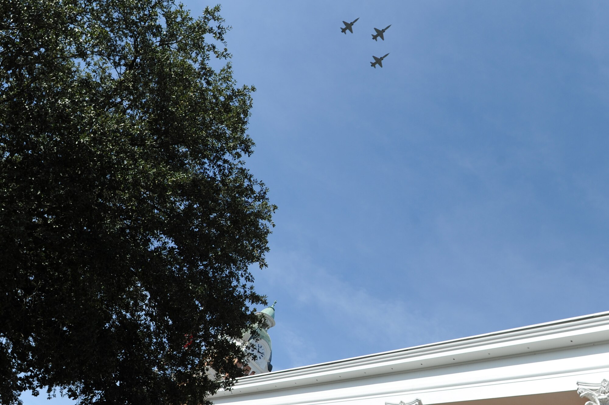 T-38 Talons from Columbus Air Force Base, Mississippi, fly over the Lowndes County Courthouse during a Veterans Day ceremony Nov. 11, 2017, in Columbus, Mississippi. Members of Columbus AFB and the city of Columbus came together to organize a parade and ceremony to honor veterans. (U.S. Air Force photo by Staff Sgt. Christopher Gross)