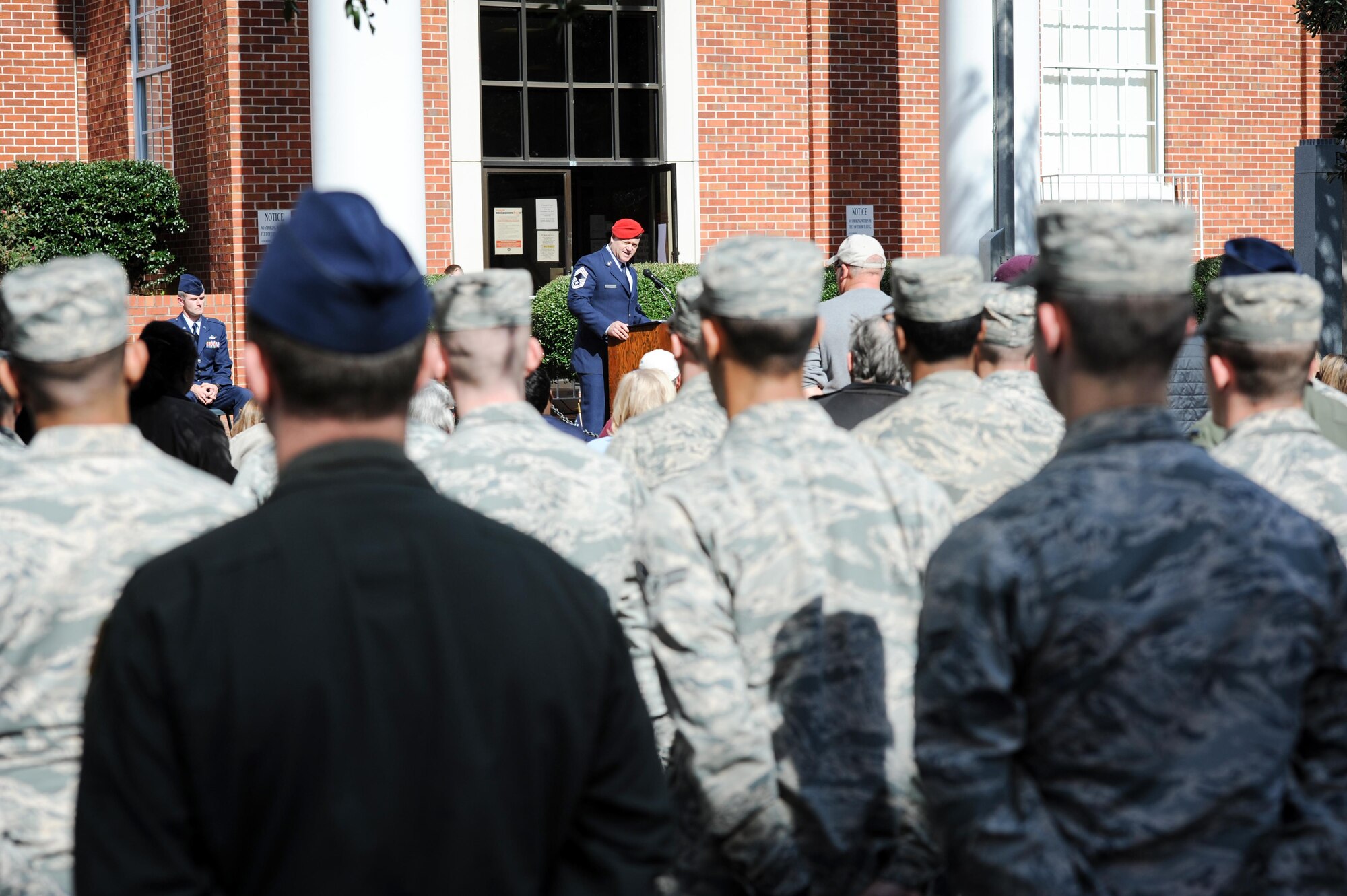 Chief Master Sgt. Bradley Reilly, 14th Operations Group Superintendent, speaks to a crowd during a Veterans Day ceremony Nov. 11, 2017, in Columbus, Mississippi. Reilly was the guest speaker for the ceremony, which also included a parade beforehand. (U.S. Air Force photo by Staff Sgt. Christopher Gross)