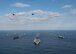 Two U.S. Air Force B-l B Lancers assigned to the 37th Expeditionary Bomb Squadron, deployed from Ellsworth Air Force Base, South Dakota, along with U.S. Navy F/A-18 Hornet fighter jets, perform a flyover of the USS Ronald Reagan (CVN 76), USS Nimitz (CVN 68), and USS Theodore Roosevelt (CVN 71) Carrier Strike Groups in the Western Pacific, Nov. 11, 2017.