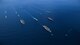 Two U.S. Air Force B-l B Lancers assigned to the 37th Expeditionary Bomb Squadron, deployed from Ellsworth Air Force Base, South Dakota, along with U.S. Navy F/A-18 Hornet fighter jets, perform a flyover of the USS Ronald Reagan (CVN 76), USS Nimitz (CVN 68), and USS Theodore Roosevelt (CVN 71) Carrier Strike Groups in the Western Pacific, Nov. 11, 2017.