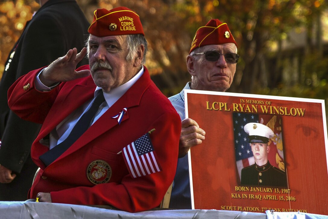 Two men rest from marching.