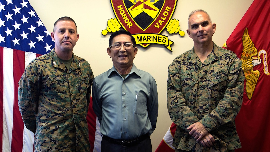 Col. Jeffery M. Morgan (Left), Mr. Sonny Wong (Center) and Sgt. Maj. Douglas W. Yagel (Right) share stories about the unit Nov. 7, 2017, at 12th Marine Regiment’s company office on Camp Hansen, Okinawa, Japan. Wong was an interpreter attached to 12th Marines during the Vietnam War and decided to visit his old unit 51 years later. Yagel gave him a tour of the Regiment’s facilities and weapons as Wong described his experience working with the Marines.